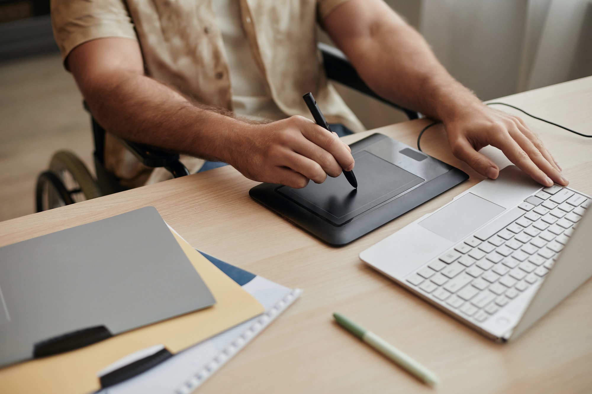 Close Up of Man Using Pen Tablet Editing Photos or Video at Home Office