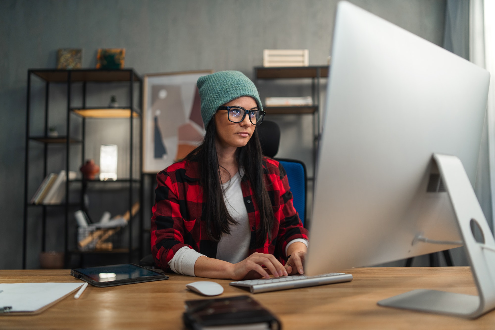 Female video editor works indoors in creative office studio